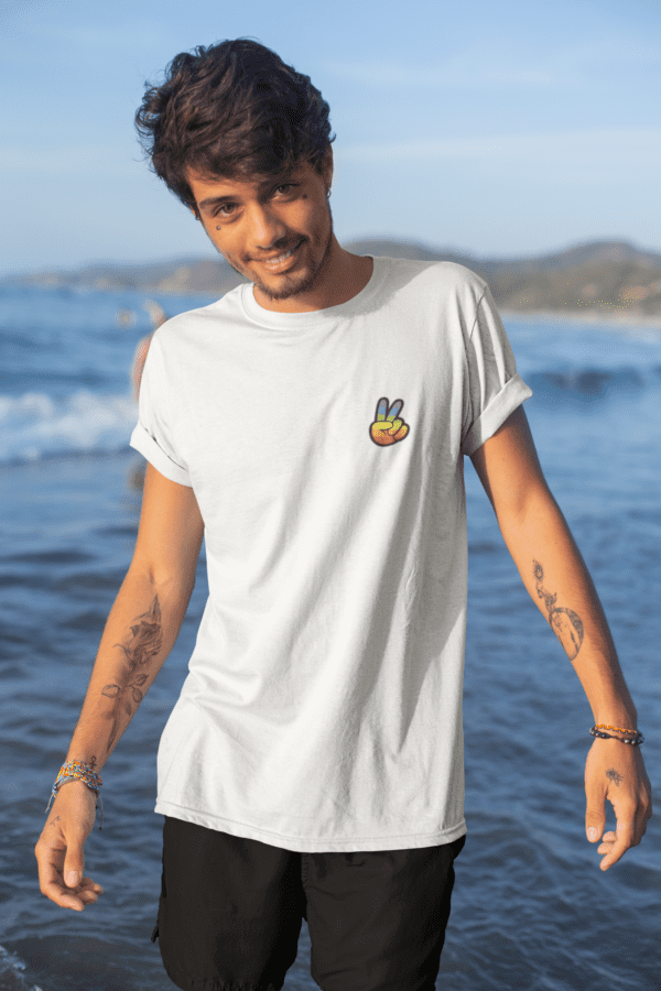 mockup of a tattooed young man by the sea wearing a t shirt 26767