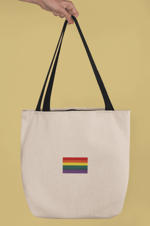 mockup of a hand holding a tote bag in a studio 24831