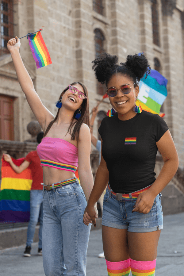 t shirt mockup of a woman holding another woman s hand at pride parade 32986